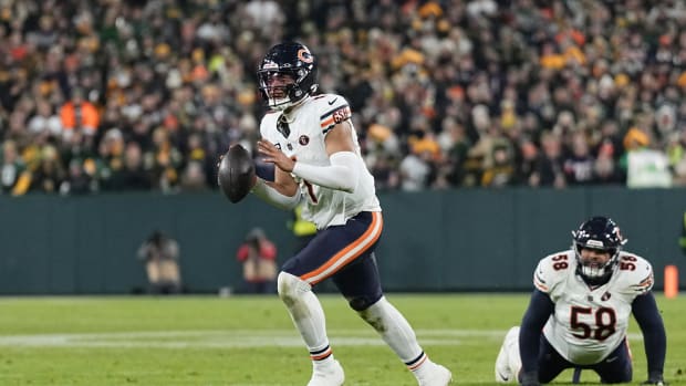 Jan 7, 2024; Green Bay, Wisconsin, USA; Chicago Bears quarterback Justin Fields (1) looks to throw a pass during the fourth quarter against the Green Bay Packers at Lambeau Field. Mandatory Credit: Jeff Hanisch-USA TODAY Sports  